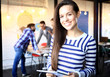 © opolja - Modern business woman in the office with copy space.