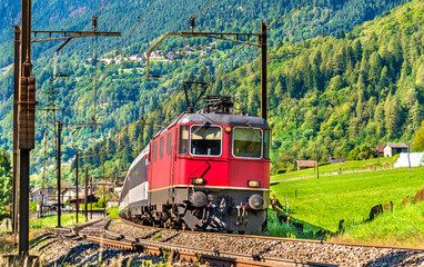 Canvas Print - Passenger train is going down the Gotthard pass - Switzerland