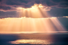 Rays Of Light After Rain Storm, Seascape With Sun Reflections On Water Surface.