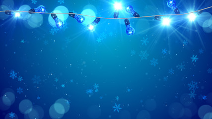 Wall Mural - christmas blue light bulbs and snowfall