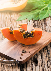 sliced papaya fresh fruit on wood block a