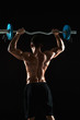 © nazarovsergey - bodybuilder lifting a barbell on black background