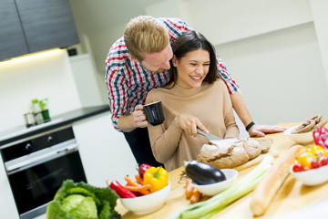 Wall Mural - Young couple in the kitchen