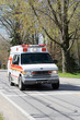 Emergency Ambulance Vehicle – An ambulance drives down the road.