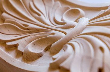 Wood processing. Joinery work. wood carving element close up. small depth of field. use as background