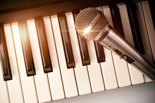 Piano And Microphone With Golden Sparkles Top View
