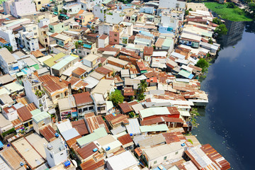 Colorful slum houses at Ho Chi Minh city (view from top), Vietnam. Ho Chi Minh city (aka Saigon) is the largest city and economic center in Vietnam with population around 10 million people.