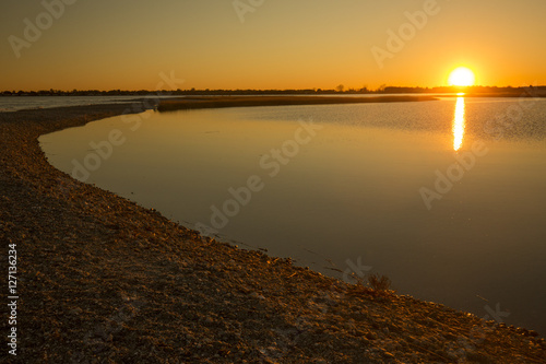 Fotografie, Obraz Warm sunset over the marsh at Milford Point, Connecticut.