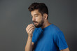 © kleberpicui - Bad breath. Halitosis concept. Young man checking his breath with his hand.