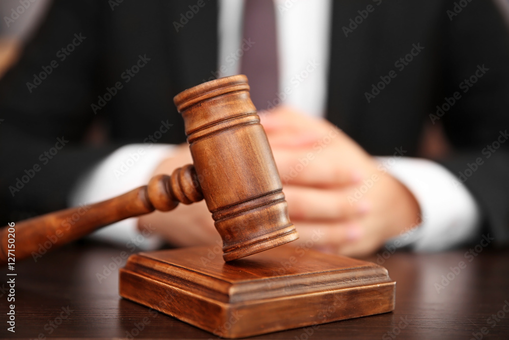 Court hammer on table, closeup