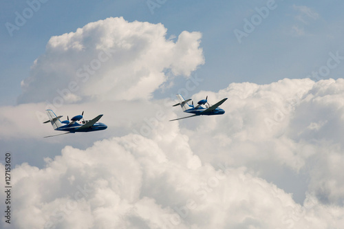 Valokuva pair of the Flying airplane Be-103 in clouds