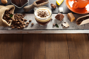 Poster - cup of coffee and ingredients on wood