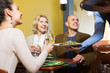 © caftor - Waiter taking order at table of people having dinner together
