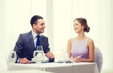 Sticker - smiling couple looking at each other at restaurant