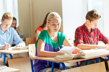 Poster - group of students with books writing school test