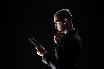 close up of businessman with transparent tablet pc