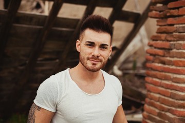 Sticker - Attractive guy with white t-shirt in a old house