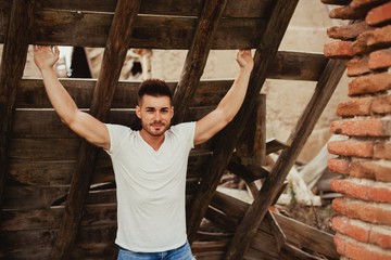 Sticker - Attractive guy with white t-shirt in a old house