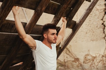 Sticker - Attractive guy with white t-shirt in a old house