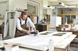 © Westend61 - Carpenter restoring a wooden door
