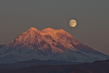 Moonrise  at sunset over Mt Rainier