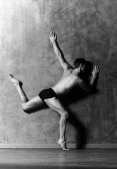 Wall Mural - Ballet dancer performing in a studio