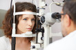 © Stocked House Studio - Woman doing eye test with optometrist in medical office