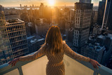 Fototapeta  - Rich woman enjoy the sunset standing on the balcony at luxury apartments in New York City. Luxury life concept. Succesful B.businesswoman relax.