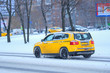 © Dmitry Vereshchagin - Moscow, Russia - November, 12, 2016: Taxi on a snow-covered road after high snow-storm in Moscow, Russia