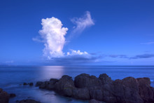 White Thunderhead Cloud Over Calm Sea