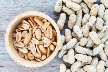 Poster - Roasted salted peanuts in wooden bowl.

