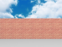High Brick Wall On Blue Cloudy Sky Background