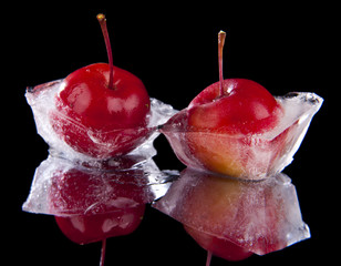 frozen in chunks of ice, red apples