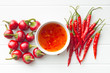 © Jiri Hera - Red chili peppers and chili sauce.