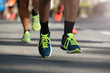 © pavel1964 - Marathon running race, people feet on city road