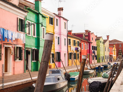 colorful street of burano island in venice, italy Poster