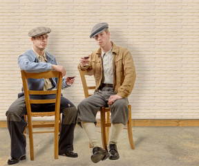 Wall Mural - two young men with clothes and cap in 30s style.