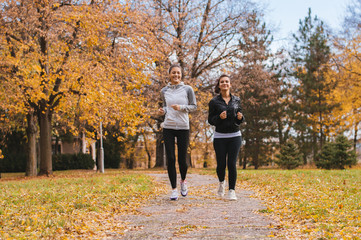 Beautiful girls Jogging Together outdoors