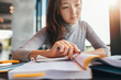 © Jacob Lund - Student doing assignments in library