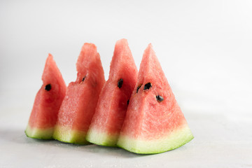 Slices of watermelon on white background