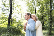 © Westend61 - Happy senior couple relaxing together in the woods