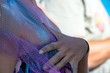woman hand on breast painted body
