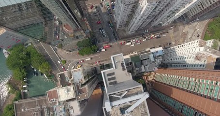 Wall Mural - Aerial view of Hong Kong skyline in the day time.Beautiful aerial shot of many high skyscrapers, busy road, city traffic. Top view of downtown.