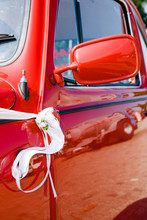 Details Of A Red And Shiny Vintage Beetle Car..