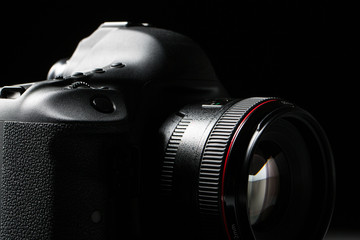 Poster - Professional modern DSLR camera low key stock photo/image 