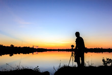  Silhouette Of A Photographer Shooting Sunset Scene