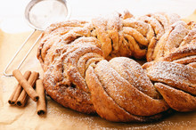 Braided Cinnamon Roll Cake On Wooden Background.
