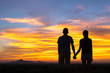 © max_play - Silhouette of Happy Young Couple Hugging Outside at Sunset