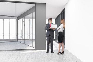 Wall Mural - People in an empty office with glass and white concrete walls