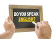 Do you speak english? Hand writing on chalkboard